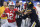 ARLINGTON, TEXAS - DECEMBER 29: TreVeyon Henderson #32 of the Ohio State Buckeyes runs the ball against Jaylon Carlies #1 of the Missouri Tigers during the first quarter in the Goodyear Cotton Bowl at AT&T Stadium on December 29, 2023 in Arlington, Texas. (Photo by Ron Jenkins/Getty Images)