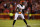 KANSAS CITY, MISSOURI - DECEMBER 31: Chidobe Awuzie #22 of the Cincinnati Bengals defends in coverage during an NFL football game against the Kansas City Chiefs at GEHA Field at Arrowhead Stadium on December 31, 2023 in Kansas City, Missouri. (Photo by Ryan Kang/Getty Images)