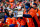 DENVER, COLORADO - DECEMBER 31:  A Denver Broncos fan with a painted face yells to support the defense in the first half of a game between the Denver Broncos and the Los Angeles Chargers at Empower Field at Mile High on December 31, 2023 in Denver, Colorado. (Photo by Dustin Bradford/Getty Images)