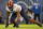 CHICAGO, ILLINOIS - DECEMBER 24: Justin Jones #93 of the Chicago Bears reacts after a sack during the first quarter against the Arizona Cardinals at Soldier Field on December 24, 2023 in Chicago, Illinois. (Photo by Quinn Harris/Getty Images)