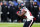 BALTIMORE, MARYLAND - JANUARY 20: Running back Devin Singletary #26 of the Houston Texans runs with the ball against the Baltimore Ravens during the AFC Divisional Playoff game at M&T Bank Stadium on January 20, 2024 in Baltimore, Maryland. (Photo by Rob Carr/Getty Images)