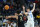 PITTSBURGH, PENNSYLVANIA - MARCH 21: Jack Gohlke #3 of the Oakland Golden Grizzlies passes against Reed Sheppard #15 of the Kentucky Wildcats during the first half in the first round of the NCAA Men's Basketball Tournament at PPG PAINTS Arena on March 21, 2024 in Pittsburgh, Pennsylvania. (Photo by Tim Nwachukwu/Getty Images)