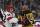 PITTSBURGH, PA - MARCH 26: Pittsburgh Penguins center Sidney Crosby (87) and Carolina Hurricanes left wing Jake Guentzel (59) face-off during the first period in the NHL game between the Pittsburgh Penguins and the Carolina Hurricanes on March 26, 2024, at PPG Paints Arena in Pittsburgh, PA. (Photo by Jeanine Leech/Icon Sportswire via Getty Images)