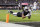 LAS VEGAS, NEVADA - DECEMBER 14: Jakobi Meyers #16 of the Las Vegas Raiders dives as he completes a pass for a touchdown against Michael Davis #43 of the Los Angeles Chargers during an NFL football game between the Las Vegas Raiders and the Los Angeles Chargers at Allegiant Stadium on December 14, 2023 in Las Vegas, Nevada. (Photo by Michael Owens/Getty Images)