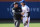 NEW YORK, NEW YORK - MARCH 29: Jeff McNeil #1 of the New York Mets is held back by umpire Jonathan Parra #121 after a play involving Rhys Hoskins #12 of the Milwaukee Brewers during the top of the eighth inning in the home opener at Citi Field on March 29, 2024 in New York City. (Photo by Christopher Pasatieri/Getty Images)