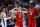 DALLAS, TEXAS - MARCH 31: Michael O'Connell #12 of the North Carolina State Wolfpack and DJ Burns Jr. #30 of the North Carolina State Wolfpack react after drawing a foul in the second half of the Elite 8 round of the NCAA Men's Basketball Tournament against the Duke Blue Devils at American Airlines Center on March 31, 2024 in Dallas, Texas. (Photo by Carmen Mandato/Getty Images)