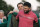 Scottie Scheffler of the United States puts the green jacket on Jon Rahm front of Spain during the awarding ceremony for the 2023 Masters golf tournament at Augusta National Golf Club, in Augusta, the United States, on April 9, 2022. (Photo by Wu Xiaoling/Xinhua via Getty Images)
