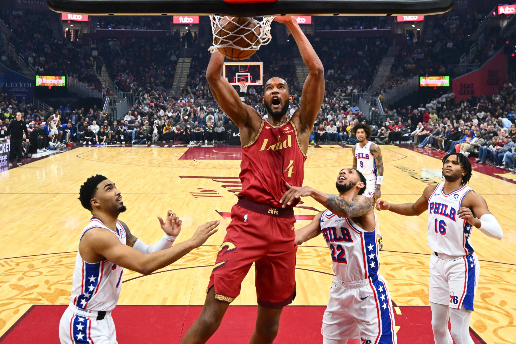 CLEVELAND, OHIO - FEBRUARY 12: Evan Mobley #4 of the Cleveland Cavaliers dunks over Cameron Payne #22 of the Philadelphia 76ers during the first quarter at Rocket Mortgage Fieldhouse on February 12, 2024 in Cleveland, Ohio. The 76ers defeated the Cavaliers 123-121. NOTE TO USER: User expressly acknowledges and agrees that, by downloading and or using this photograph, User is consenting to the terms and conditions of the Getty Images License Agreement. (Photo by Jason Miller/Getty Images)