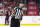 OTTAWA, ON - MARCH 17: Referee Steve Kozari (40) hnags onto the puck after second period National Hockey League action between the Carolina Hurricanes and Ottawa Senators on March 17, 2024, at Canadian Tire Centre in Ottawa, ON, Canada. (Photo by Richard A. Whittaker/Icon Sportswire via Getty Images)