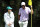 AUGUSTA, GEORGIA - APRIL 10: Scottie Scheffler of the United States looks on with his sister on the ninth green during the Par Three Contest prior to the 2024 Masters Tournament at Augusta National Golf Club on April 10, 2024 in Augusta, Georgia. (Photo by Warren Little/Getty Images)