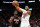 MIAMI, FLORIDA - DECEMBER 08: Donovan Mitchell #45 of the Cleveland Cavaliers throws a pass over Jimmy Butler #22 of the Miami Heat during the first quarter at Kaseya Center on December 08, 2023 in Miami, Florida. NOTE TO USER: User expressly acknowledges and agrees that, by downloading and or using this photograph, User is consenting to the terms and condtions of the Getty Images License Agreement.  (Photo by Rich Storry/Getty Images)