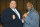 TOKYO, JAPAN: Taro Akebono (L), Japan's first foreign-born sumo grand champion, and American K-1 fighter Bob Sapp make a fighting pose during a news conference at a Tokyo hotel, 06 November 2003. The 34-year-old Hawaiian-born Akebono said that he left the traditional world of the national sport to become a fighter in the violent karate-based combat sport, called "K-1". AFP PHOTO/JIJI PRESS (Photo credit should read AFP/AFP via Getty Images)
