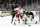 BOSTON, MA - APRIL 09: Carolina Hurricanes left wing Jake Guentzel (59) sets up in front of Boston Bruins goalie Jeremy Swayman (1) on the power play during a game between the Boston Bruins and the Carolina Hurricanes on April 9, 2024, at TD Garden in Boston, Massachusetts. (Photo by Fred Kfoury III/Icon Sportswire via Getty Images)