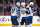 DENVER, COLORADO - APRIL 13: Connor Hellebuyck #37 and David Gustafsson #19 of the Winnipeg Jets hug in celebration after beating the Colorado Avalanche 7-0 at Ball Arena on April 13, 2024 in Denver, Colorado. (Photo by Ashley Potts/NHLI via Getty Images)