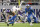 MINNEAPOLIS, MINNESOTA - DECEMBER 24: T.J. Hockenson #87 of the Minnesota Vikings is tackled by Kerby Joseph #31 of the Detroit Lions during the third quarter at U.S. Bank Stadium on December 24, 2023 in Minneapolis, Minnesota. (Photo by Stephen Maturen/Getty Images)