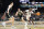 GLENDALE, ARIZONA - APRIL 08: Tristen Newton #2 of the Connecticut Huskies dribbles the ball while being guarded by Zach Edey #15 of the Purdue Boilermakers in the second half during the NCAA Men's Basketball Tournament National Championship game at State Farm Stadium on April 08, 2024 in Glendale, Arizona. (Photo by Christian Petersen/Getty Images)