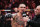 LAS VEGAS, NEVADA - APRIL 13: (R-L) Joe Rogan interviews Max Holloway in the BMF championship fight during the UFC 300 event at T-Mobile Arena on April 13, 2024 in Las Vegas, Nevada. (Photo by Jeff Bottari/Zuffa LLC via Getty Images)