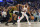 SAN FRANCISCO, CALIFORNIA - FEBRUARY 10: Kevin Durant #35 of the Phoenix Suns is guarded by Jonathan Kuminga #00 of the Golden State Warriors in the first quarter at Chase Center on February 10, 2024 in San Francisco, California. NOTE TO USER: User expressly acknowledges and agrees that, by downloading and or using this photograph, User is consenting to the terms and conditions of the Getty Images License Agreement. (Photo by Lachlan Cunningham/Getty Images)
