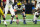 INDIANAPOLIS, IN - DECEMBER 02: Michigan Wolverines offensive lineman Drake Nugent (60) prepares to snap the ball during the Big 10 Championship game between the Michigan Wolverines and Iowa Hawkeyes on December 2, 2023, at Lucas Oil Stadium in Indianapolis, IN. (Photo by Zach Bolinger/Icon Sportswire via Getty Images)