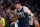 DALLAS, TEXAS - APRIL 26: Luka Doncic #77 of the Dallas Mavericks is greeted by Kyrie Irving #11 as he walks off the court after being injured during the first half of game three of the Western Conference First Round Playoffs at American Airlines Center on April 26, 2024 in Dallas, Texas. NOTE TO USER: User expressly acknowledges and agrees that, by downloading and or using this photograph, User is consenting to the terms and conditions of the Getty Images License Agreement. (Photo by Sam Hodde/Getty Images)