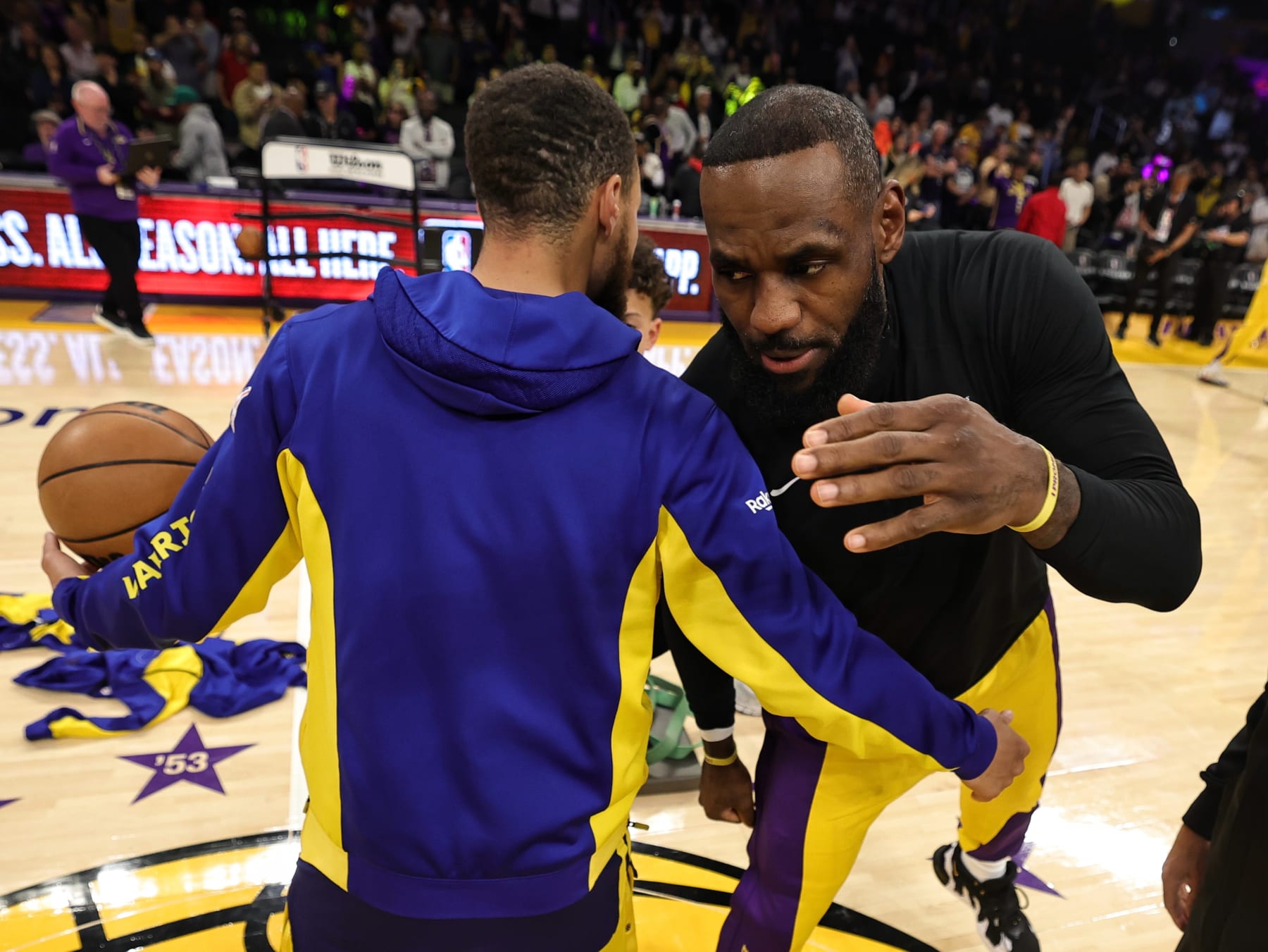 LOS ANGELES, CA - APRIL 9:  Stephen Curry #30 of the Golden State Warriors & LeBron James #23 of the Los Angeles Lakers embrace before the game on April 9, 2024 at Cryto.com Arena in Los Angeles, California. NOTE TO USER: User expressly acknowledges and agrees that, by downloading and/or using this photograph, user is consenting to the terms and conditions of the Getty Images License Agreement.  Mandatory Copyright Notice: Copyright 2024 NBAE (Photo by Jim Poorten/NBAE via Getty Images)