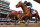 LOUISVILLE, KENTUCKY - MAY 04: Mystik Dan #3, ridden by jockey Brian J. Hernandez Jr. (R), crosses the finish line ahead of Sierra Leone #2, ridden by jockey Tyler Gaffalione and Forever Young, ridden by jockey Ryusei Sakai to win the 150th running of the Kentucky Derby at Churchill Downs on May 04, 2024 in Louisville, Kentucky. (Photo by Michael Reaves/Getty Images)