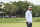 HILTON HEAD ISLAND, SOUTH CAROLINA - APRIL 22: Scottie Scheffler smiles with caddie Ted Scott following his three stroke victory on the 18th hole green during the continuation of the final round of the RBC Heritage at Harbour Town Golf Links on April 22, 2024 in Hilton Head Island, South Carolina. (Photo by Keyur Khamar/PGA TOUR via Getty Images)