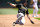 OAKLAND, CALIFORNIA - MAY 01: Bryan Reynolds #10 of the Pittsburgh Pirates slides into third base against the Oakland Athletics in the top of the third inning on May 1, 2024 at the Oakland Coliseum in Oakland, California. (Photo by Thearon W. Henderson/Getty Images)