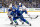 VANCOUVER, CANADA - MAY 16: J.T. Miller #9 of the Vancouver Canucks and Darnell Nurse #25 of the Edmonton Oilers battle for the puck during the first period in Game Five of the Second Round of the 2024 Stanley Cup Playoffs at Rogers Arena on May 16, 2024 in Vancouver, British Columbia, Canada. (Photo by Jeff Vinnick/NHLI via Getty Images)