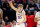 SALT LAKE CITY, UTAH - MARCH 21: Johnny Furphy #10 of the Kansas Jayhawks celebrates a basket against the Samford Bulldogs during the first half in the first round of the NCAA Men's Basketball Tournament at Delta Center on March 21, 2024 in Salt Lake City, Utah. (Photo by Christian Petersen/Getty Images)
