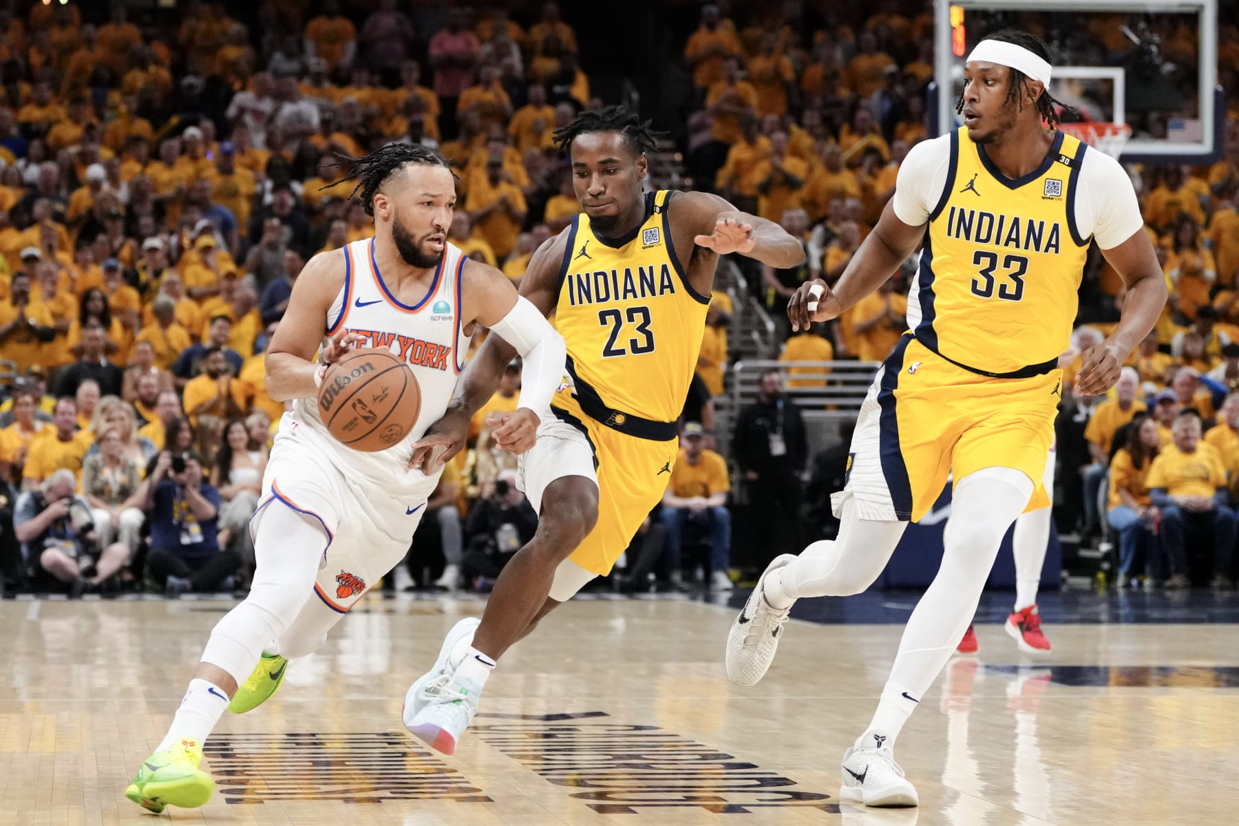 INDIANAPOLIS, INDIANA - MAY 17: Jalen Brunson #11 of the New York Knicks drives to the basket against Aaron Nesmith #23 and Myles Turner #33 of the Indiana Pacers during the first quarter in Game Six of the Eastern Conference Second Round Playoffs at Gainbridge Fieldhouse on May 17, 2024 in Indianapolis, Indiana. NOTE TO USER: User expressly acknowledges and agrees that, by downloading and or using this photograph, User is consenting to the terms and conditions of the Getty Images License Agreement. (Photo by Dylan Buell/Getty Images)