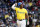 BOSTON, MA - MAY 11: Rafael Devers #11 of the Boston Red Sox heads back to the dugout after striking out against the Washington Nationals during the fourth inning at Fenway Park on May 11, 2024 in Boston, Massachusetts. (Photo By Winslow Townson/Getty Images)