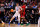 DALLAS, TEXAS - MARCH 31: Kyle Filipowski #30 of the Duke Blue Devils moves the ball against DJ Burns Jr. #30 of the NC State Wolfpack during the first half in the Elite 8 round of the NCAA Men's Basketball Tournament at American Airlines Center on March 31, 2024 in Dallas, Texas. (Photo by Lance King/Getty Images)