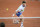 France's Arthur Rinderknech plays a backhand return to Argentina's Tomas Martin Etcheverry during their men's singles match on day five of the French Open tennis tournament at the Roland Garros Complex in Paris on May 30, 2024. (Photo by Bertrand GUAY / AFP) (Photo by BERTRAND GUAY/AFP via Getty Images)