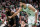 Boston, MA - June 6: Boston Celtics forward Jayson Tatum holds his hand out in front of Dallas Mavericks guard Kyrie Irving during the fourth quarter of Game 1 in the 2024 NBA Finals. (Photo by Barry Chin/The Boston Globe via Getty Images)