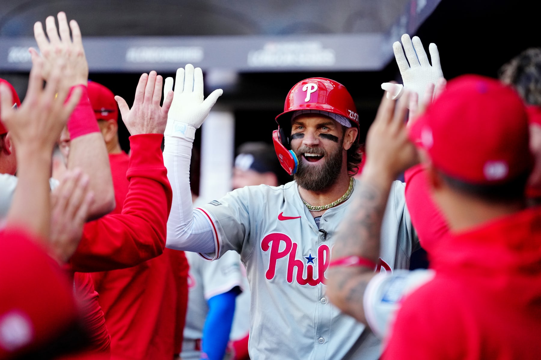 LONDON, ENGLAND - JUNE 08:  Bryce Harper #3 of the Philadelphia Phillies celebrates in the dugout after hitting a solo home run in the fourth inning during the 2024 London Series game between the Philadelphia Phillies and the New York Mets at London Stadium on Saturday, June 8, 2024 in London, England. (Photo by Mary DeCicco/MLB Photos via Getty Images)