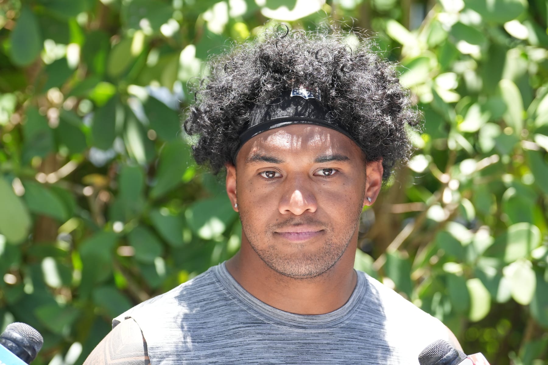 MIAMI GARDENS, FL - JUNE 04: Miami Dolphins quarterback Tua Tagovailoa (1) speaks with reports during the Miami Dolphins Mini Camp on Tuesday, June 4, 2024 at Baptist Health Training Complex in Miami Gardens, Fla. (Photo by Peter Joneleit/Icon Sportswire via Getty Images)