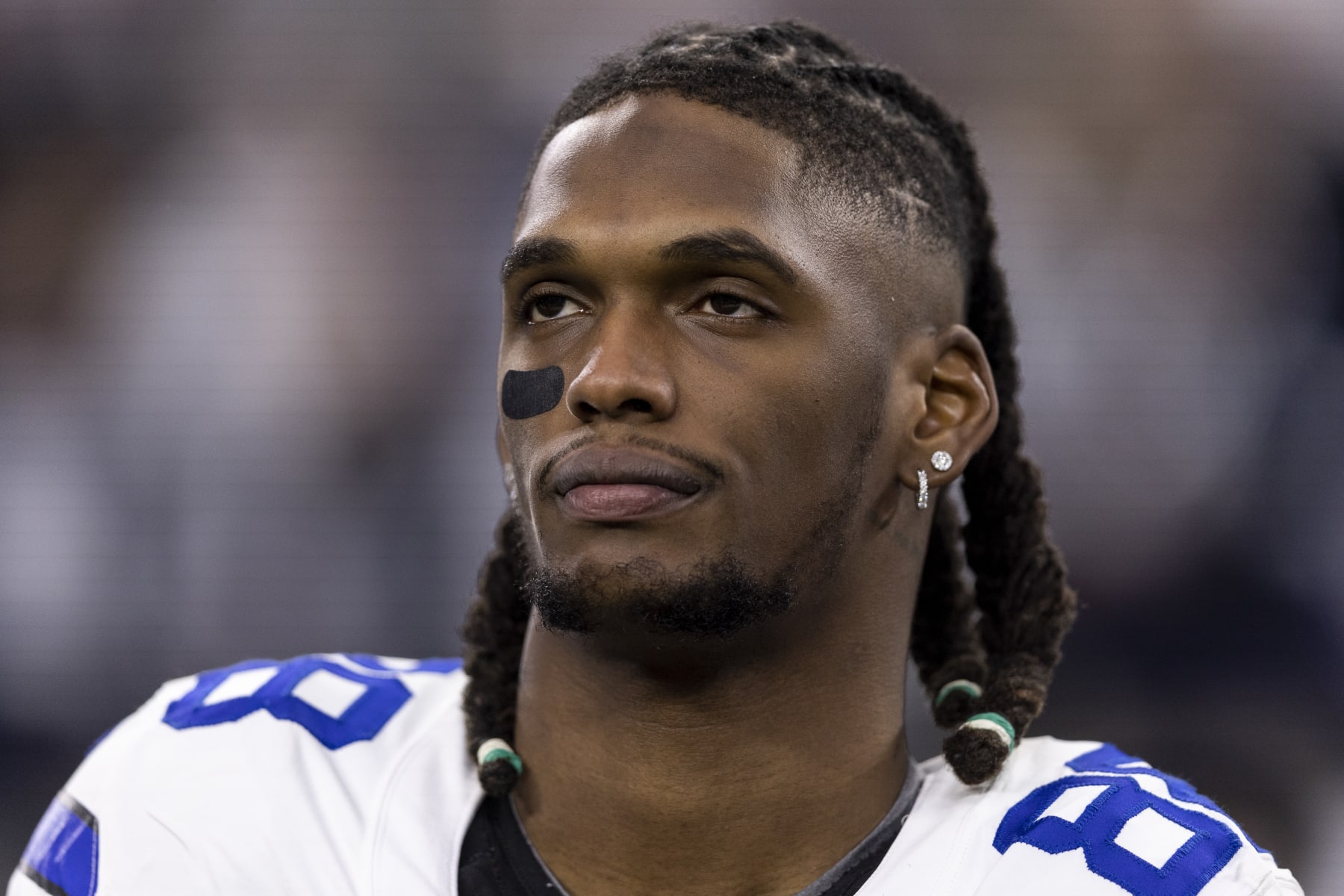 ARLINGTON, TEXAS - JANUARY 14: CeeDee Lamb #88 of the Dallas Cowboys looks on during the national anthem prior to an NFL wild-card playoff football game between the Dallas Cowboys and the Green Bay Packers at AT&T Stadium on January 14, 2024 in Arlington, Texas. (Photo by Michael Owens/Getty Images)