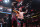 Alex Pereira hoists the UFC light heavyweight title after knocking out Jamahal Hill.