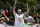 Boston, MA - June 21: Boston Celtics center Luke Kornet waves to the crowd at Copley Square during a duck boat parade to celebrate the 18th Boston Celtics NBA championship. (Photo by Danielle Parhizkaran/The Boston Globe via Getty Images)