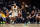 CLEVELAND, OHIO - MAY 05: Gary Harris #14 of the Orlando Magic drives around Donovan Mitchell #45 of the Cleveland Cavaliers during the fourth quarter of Game Seven of the Eastern Conference First Round Playoffs at Rocket Mortgage Fieldhouse on May 05, 2024 in Cleveland, Ohio. The Cavaliers defeated the Magic 106-94. NOTE TO USER: User expressly acknowledges and agrees that, by downloading and/or using this Photograph, user is consenting to the terms and conditions of the Getty Images License Agreement. (Photo by Jason Miller/Getty Images)