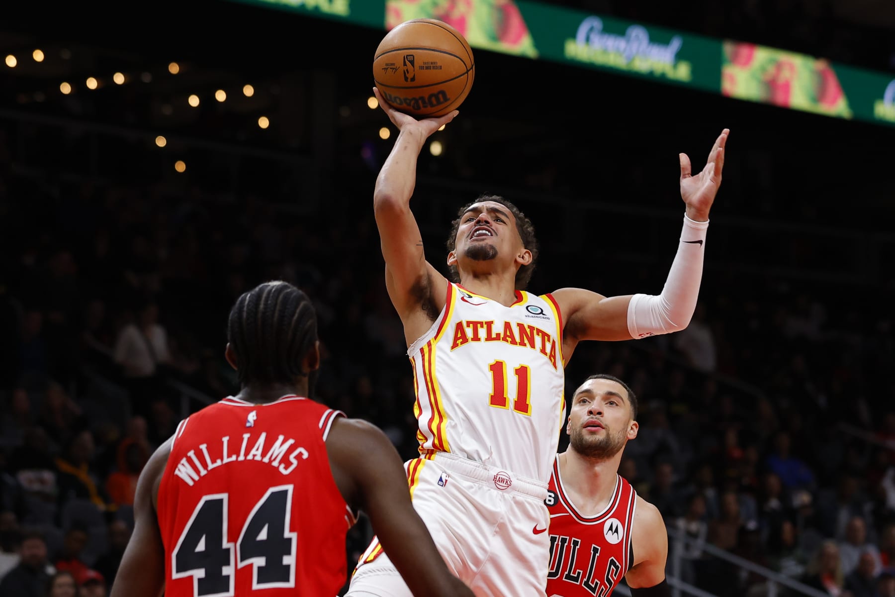 ATLANTA, GA - DECEMBER 11: Trae Younger #11 of the Atlanta Hawks shoots as he's fouled by Zach LaVine #8 of the Chicago Bulls all the plan in which by the first half of the sport at Assert Farm Arena on December 11, 2022 in Atlanta, Georgia. NOTE TO USER: Person expressly acknowledges and concurs that, by downloading and or using this photo, Person is consenting to the terms and prerequisites of the Getty Photography License Settlement. (Portray by Todd Kirkland/Getty Photography)