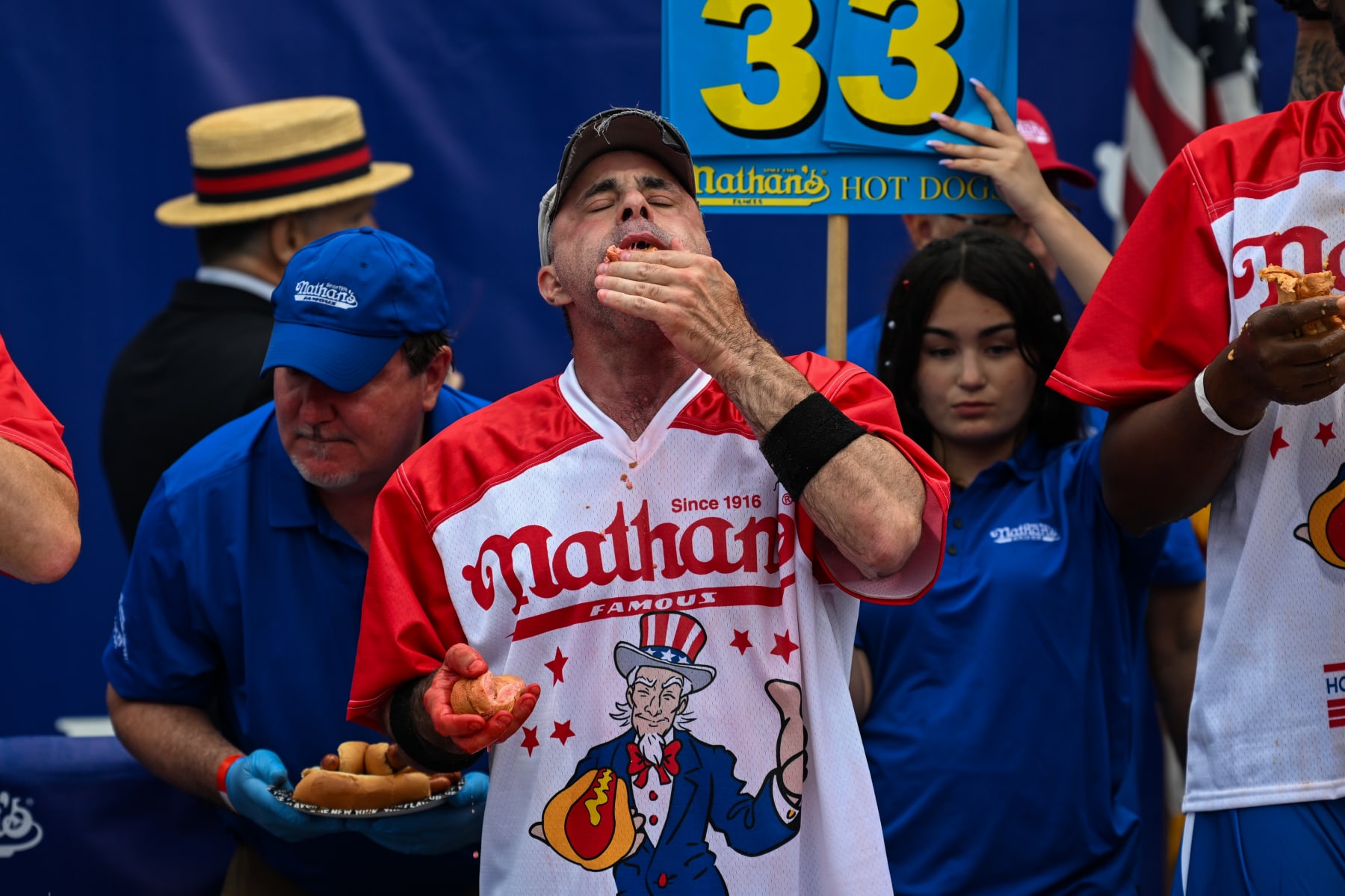 NEW YORK, NEW YORK - JULY 04: Geoffrey Esper competes in the 2023 Nathan's Famous Fourth of July International Hot Dog Eating Contest at Coney Island on July 04, 2023 in the Brooklyn borough of New York City. The annual contest, which began in 1972, draws thousands of spectators to Nathan’s Famous located on Surf Avenue. (Photo by Alexi J. Rosenfeld/Getty Images)