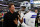ARLINGTON, TEXAS - AUGUST 26: Tom Brady jokes with Micah Parsons #11 of the Dallas Cowboys before a preseason game against the Las Vegas Raiders at AT&T Stadium on August 26, 2023 in Arlington, Texas. (Photo by Richard Rodriguez/Getty Images)