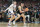 GLENDALE, ARIZONA - APRIL 08: Zach Edey #15 of the Purdue Boilermakers tries to get around Donovan Clingan #32 of the Connecticut Huskies during the National College Basketball Championship game at State Farm Stadium on April 08, 2024 in Glendale, Arizona. (Photo by Mitchell Layton/Getty Images)