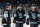 SEATTLE, WASHINGTON - MARCH 30: Eeli Tolvanen #20, Matty Beniers #10 and Oliver Bjorkstrand #22 of the Seattle Kraken talk before a face-off during the second period of a game against the Dallas Stars at Climate Pledge Arena on March 30, 2024 in Seattle, Washington. (Photo by Christopher Mast/NHLI via Getty Images)