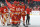 CALGARY, ALBERTA - APRIL 14: Dustin Wolf #32, Oliver Kylington #58 and teammates of the Calgary Flames celebrate a win against the Arizona Coyotes at the Scotiabank Saddledome on April 14, 2024 in Calgary, Alberta. (Photo by Gerry Thomas/NHLI via Getty Images)