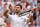 LONDON, ENGLAND - JULY 12: Novak Djokovic of Serbia celebrates winning match point with a violin gesture against Lorenzo Musetti of Italy in the Gentlemen's Singles Semi-Final match during day twelve of The Championships Wimbledon 2024 at All England Lawn Tennis and Croquet Club on July 12, 2024 in London, England. (Photo by Julian Finney/Getty Images)