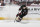 TEMPE, ARIZONA - APRIL 17: Logan Cooley #92 of the Arizona Coyotes skates with the puck against the Edmonton Oilers at Mullett Arena on April 17, 2024 in Tempe, Arizona. (Photo by Norm Hall/NHLI via Getty Images)