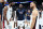 ABU DHABI, UNITED ARAB EMIRATES - JULY 17:  (L-R) Anthony Davis #14, Joel Embiid #11, LeBron James #6, Stephen Curry #4 and Nigel Hayes Davis #18 of the United States gather after an exhibition game between the United States and Serbia ahead of the Paris Olympic Games at Etihad Arena on July 17, 2024 in Abu Dhabi, United Arab Emirates. (Photo by Christopher Pike/Getty Images)